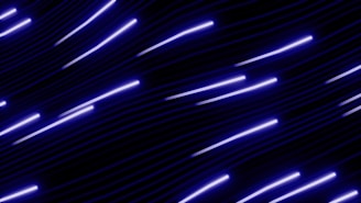 Abstract streaks of purple light against dark background