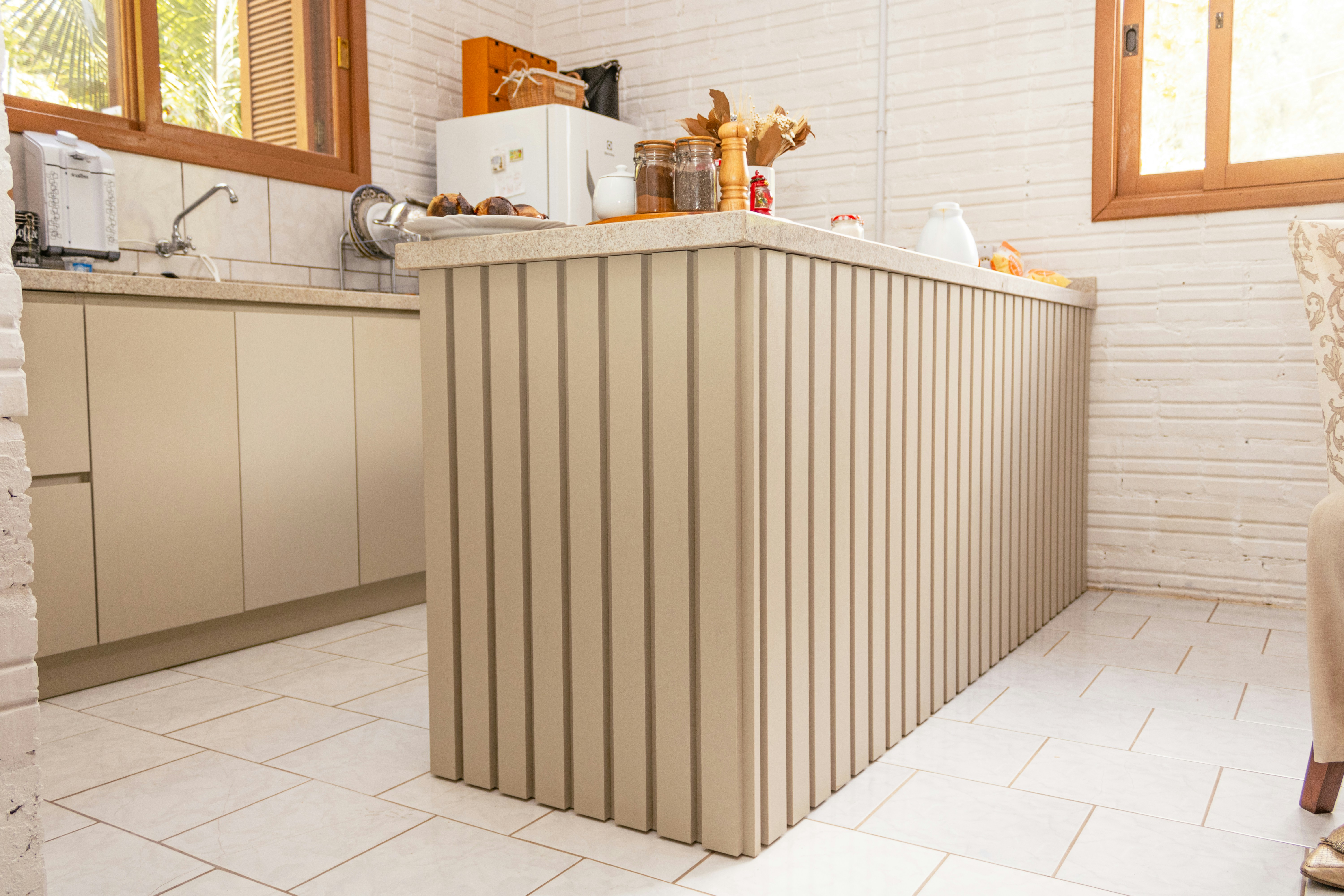 A modern kitchen island with vertical paneling