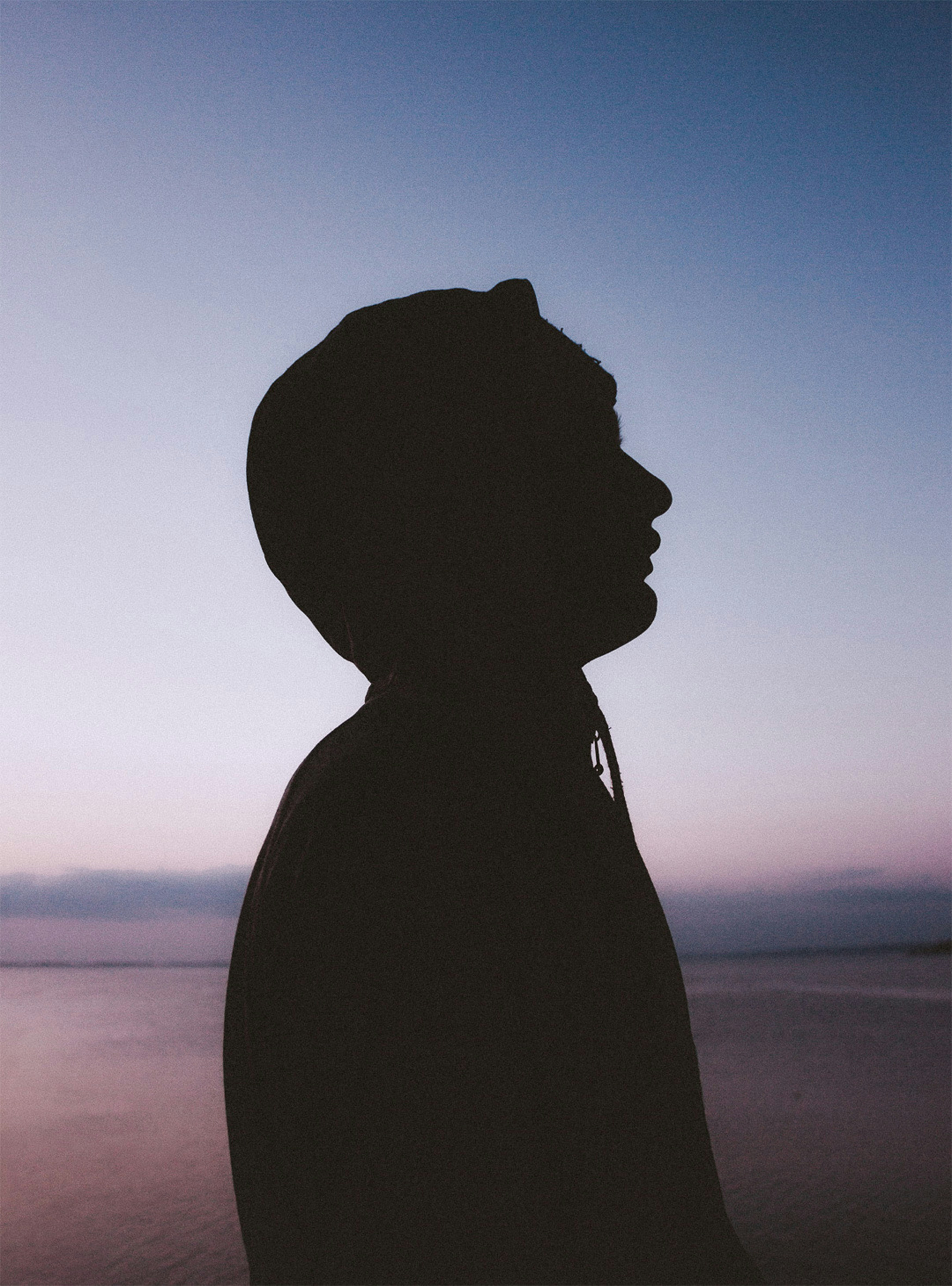 Silhouette of a person against a twilight sky