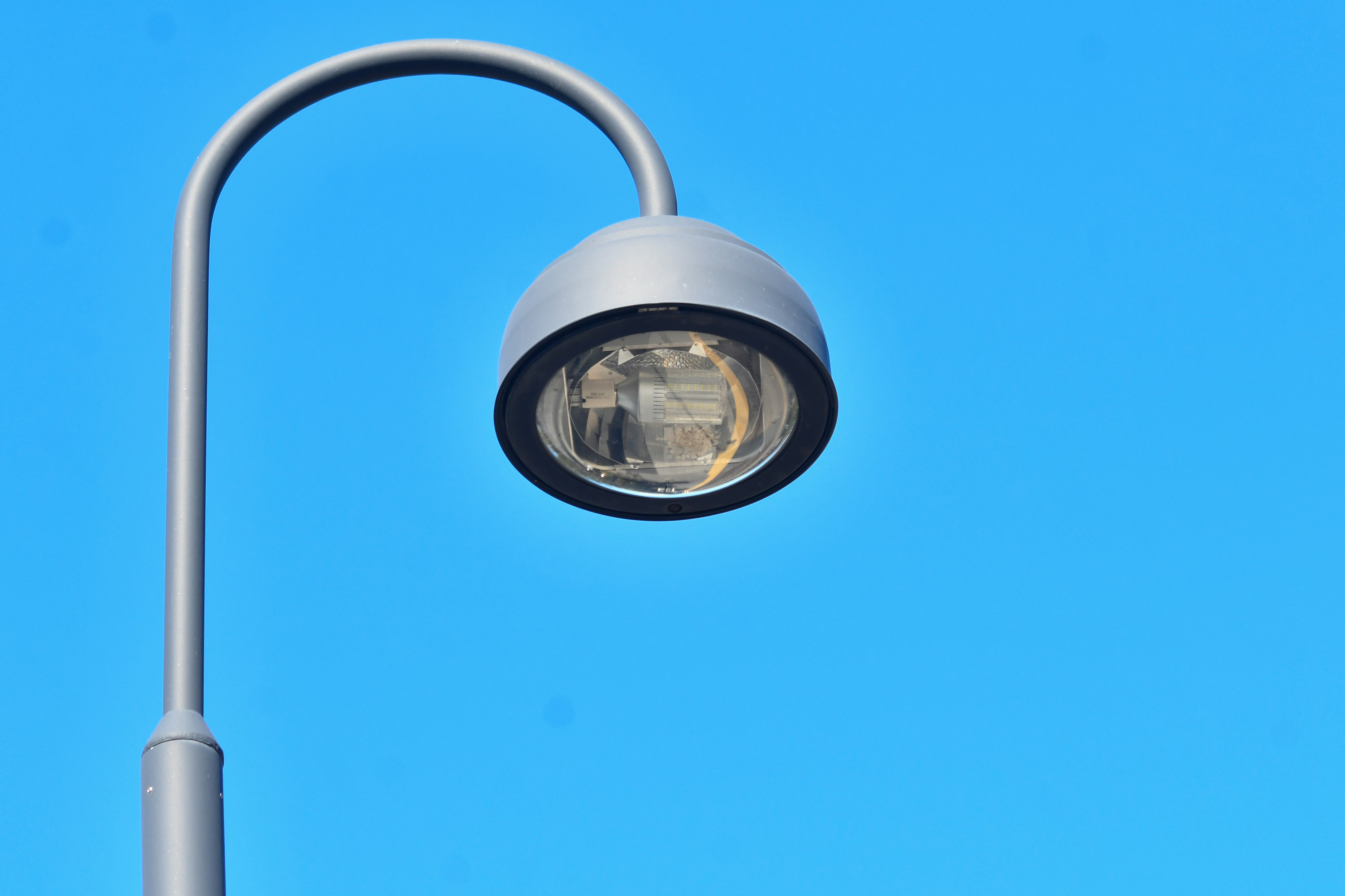 Street lamp against a clear blue sky
