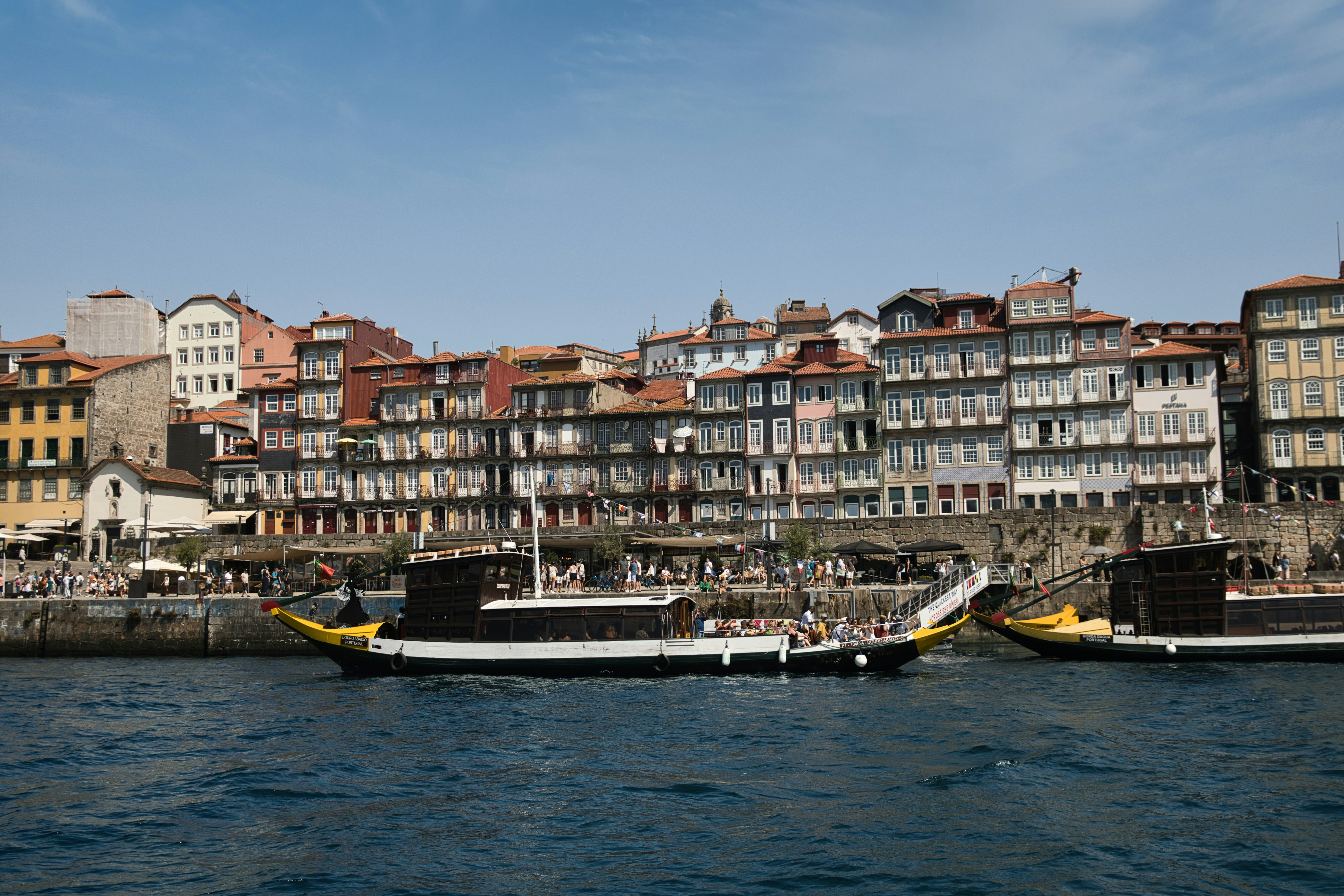 Boats on the river with buildings in the background