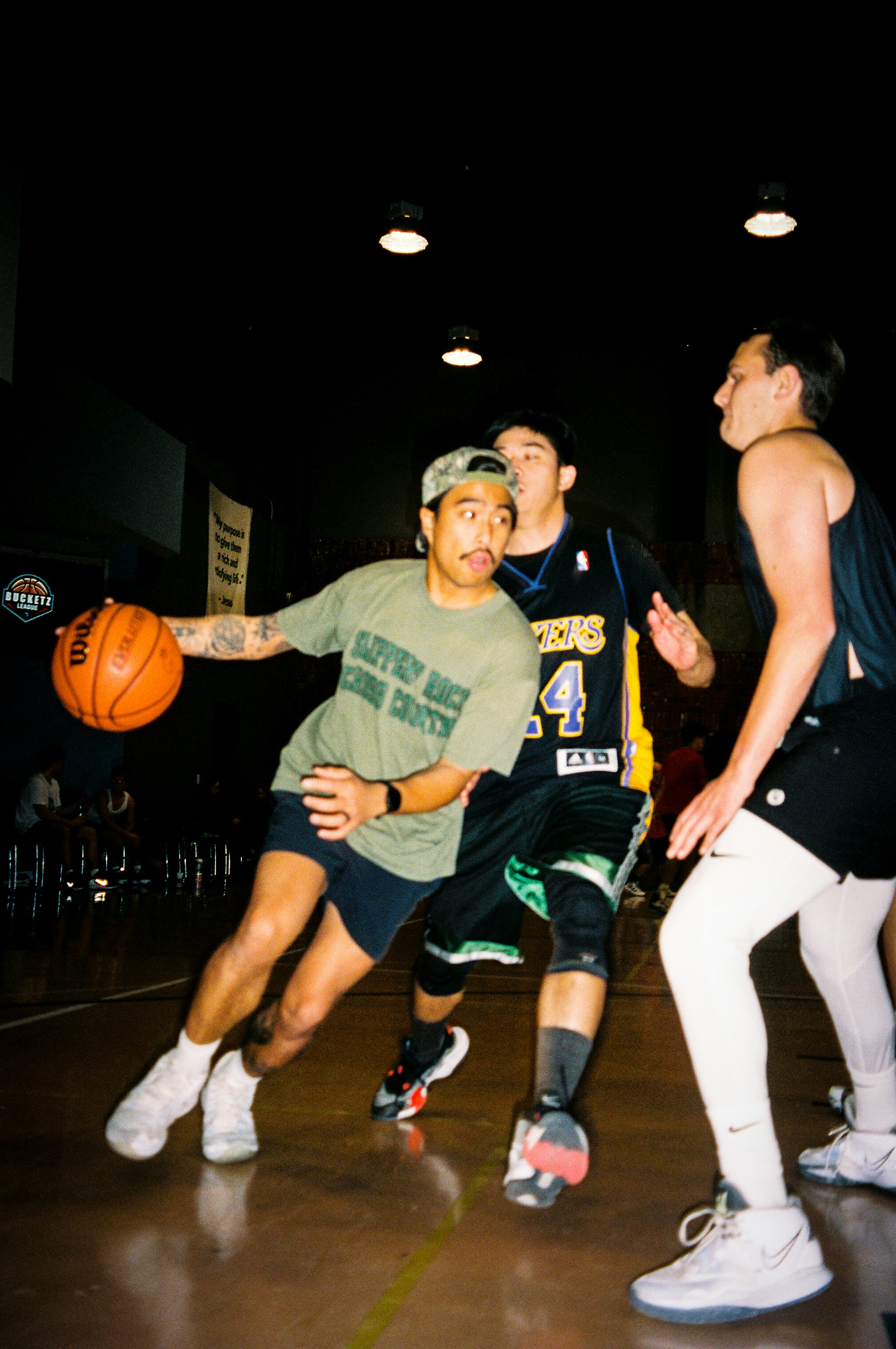 Basketball players competing on an indoor court