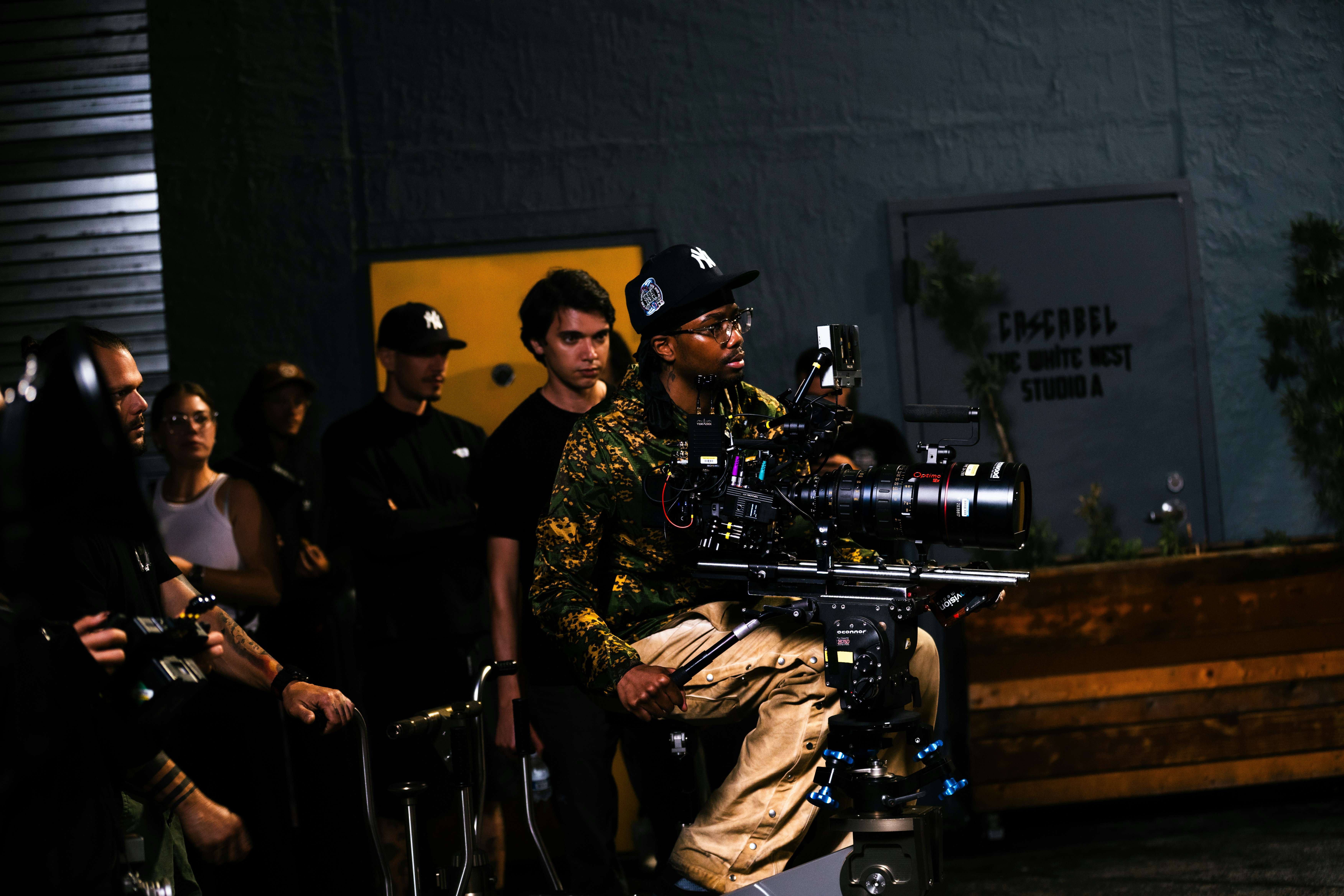 Filmmakers operating a professional cinema camera on set.