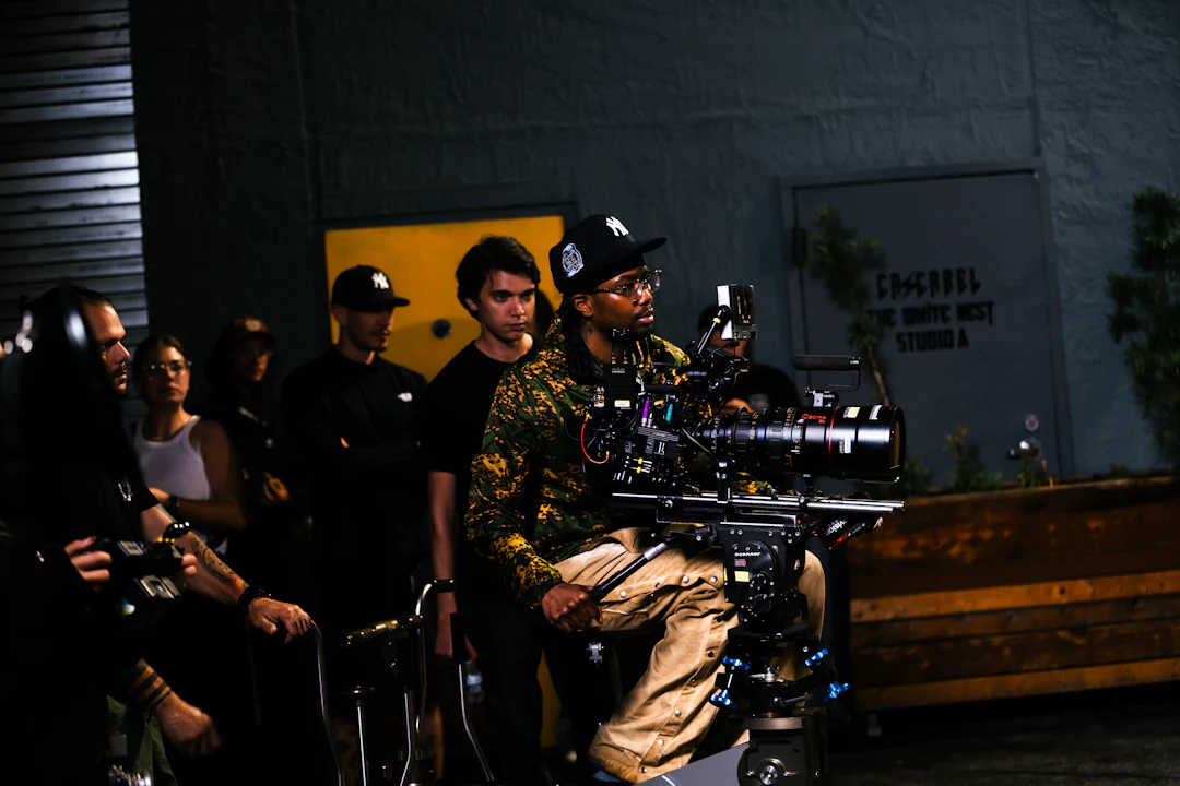 Professional cinema camera and crew on a modern production set.