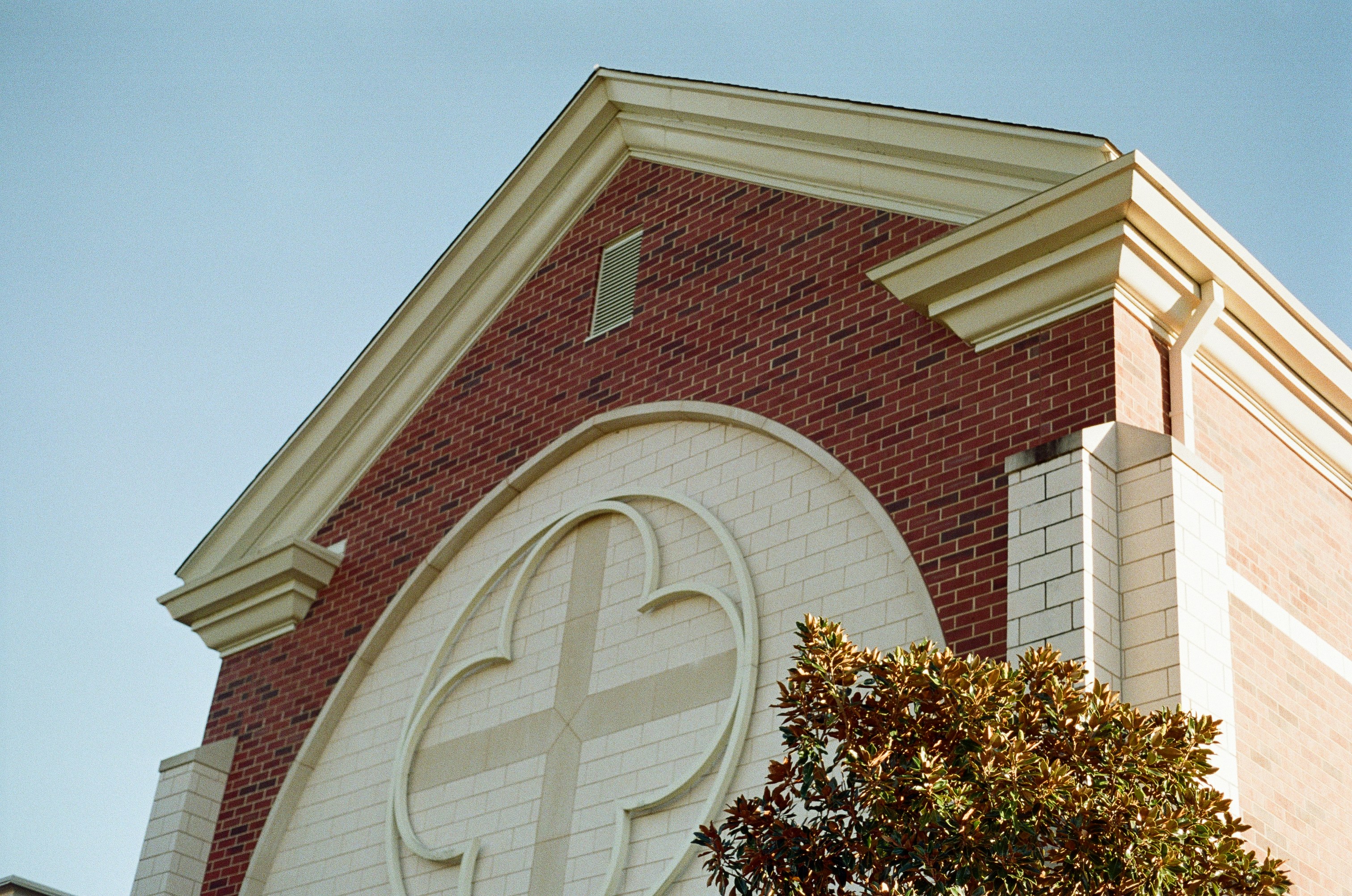 Architectural detail of a church facade with cross