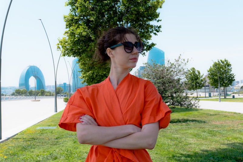 confident woman in vibrant orange dress