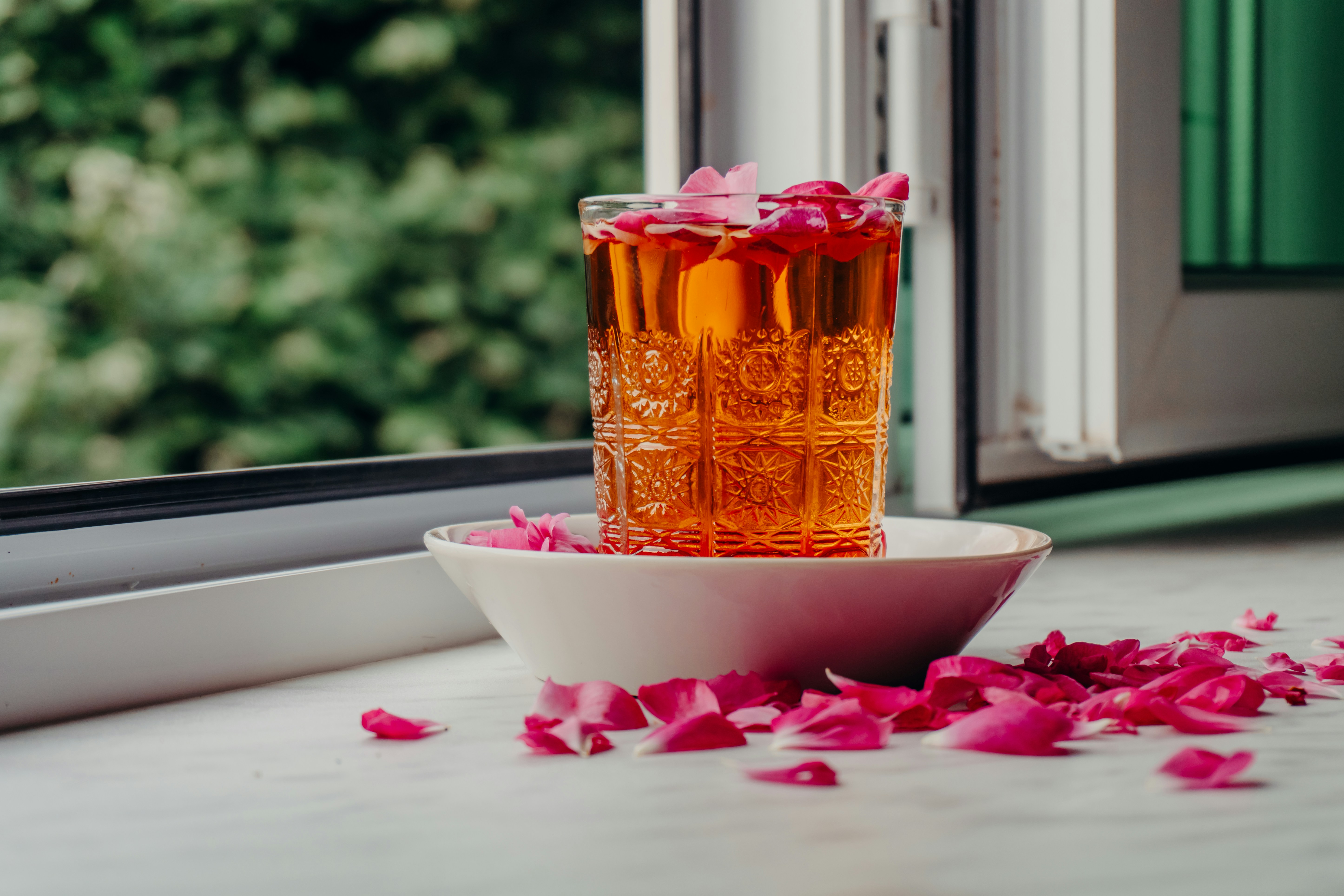 A collection of various fresh fruits and vegetables displayed on a wooden table.