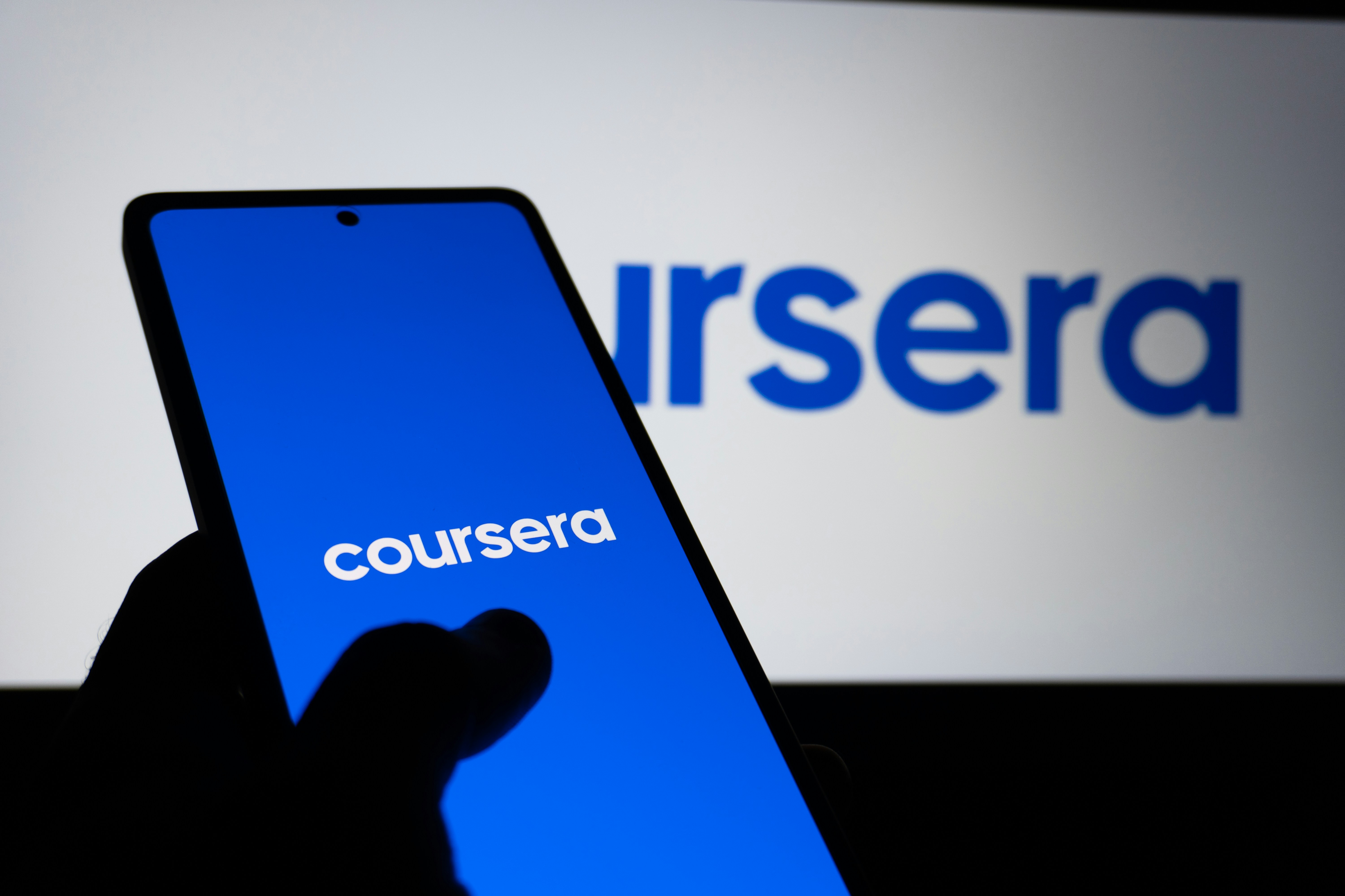 Coursera logo displayed on a smartphone screen.