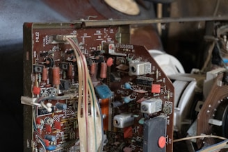 Close-up of an old electronic circuit board with wires.