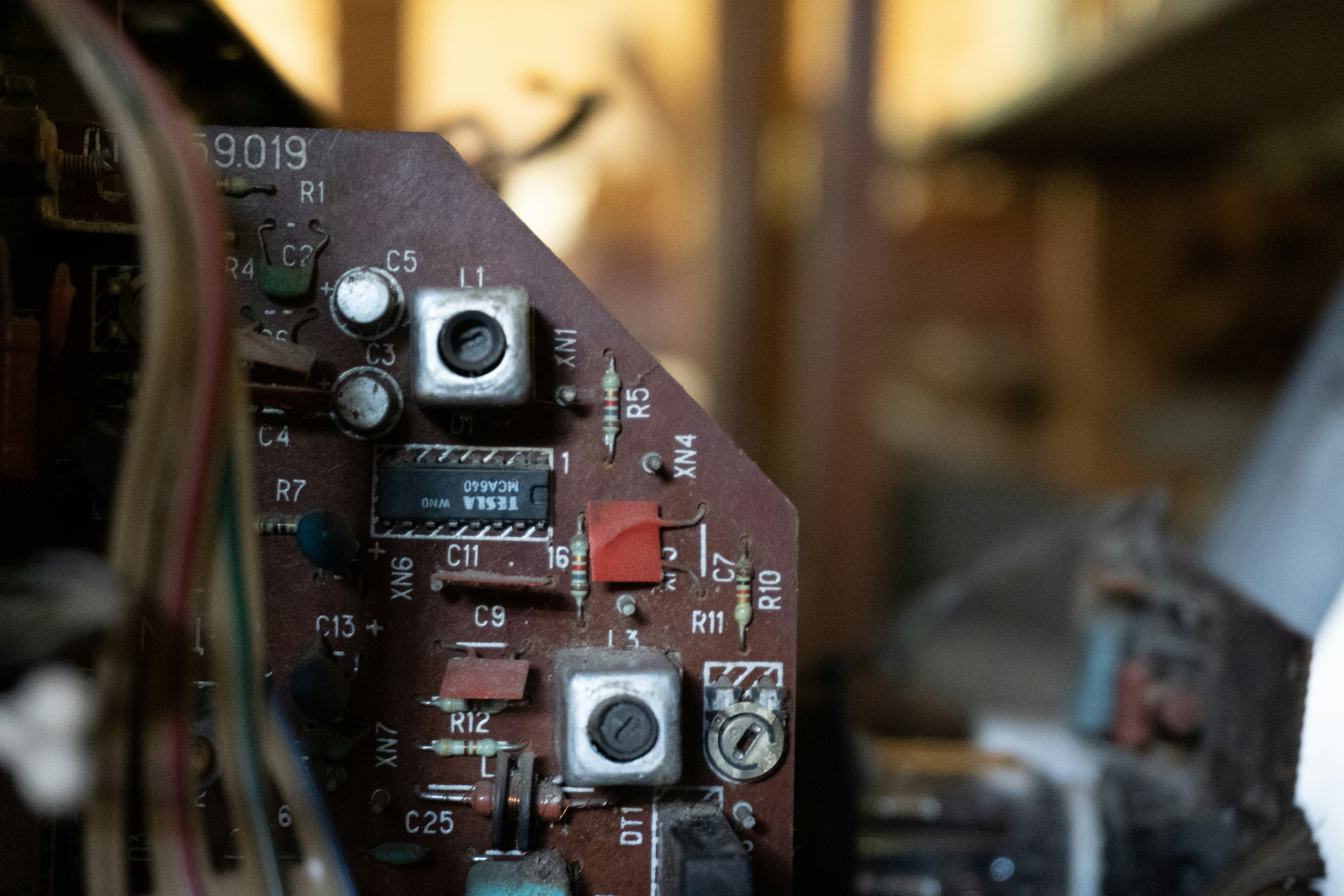 Close-up of old electronic circuit board with components.