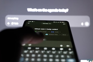 Person typing on smartphone with ai chatbot on screen.