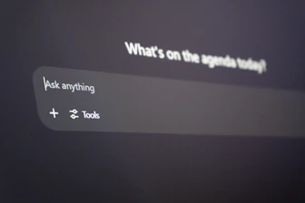 Digital interface with "ask anything" prompt.