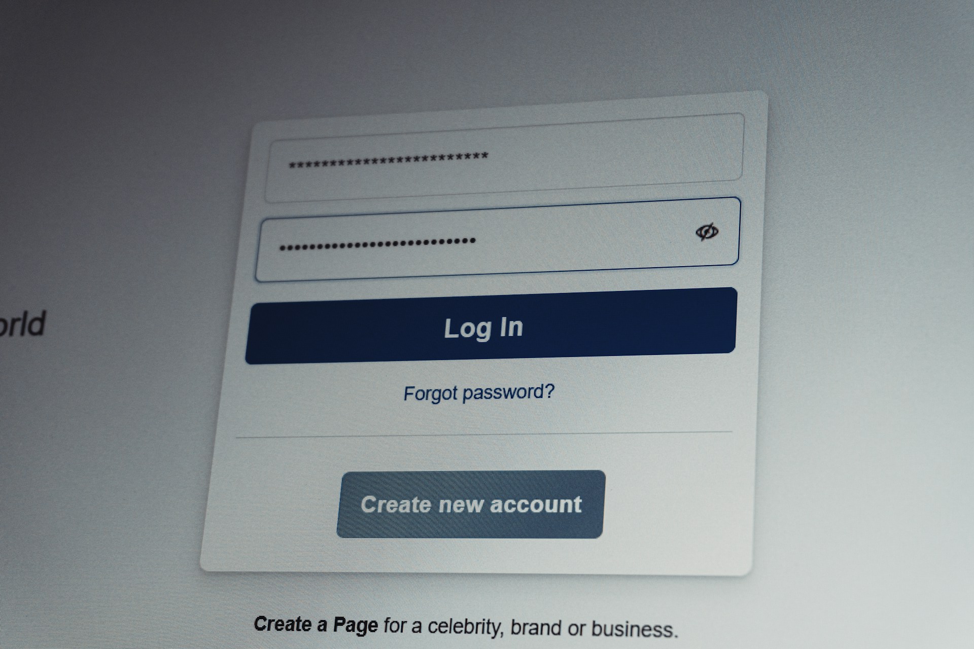 Facebook login screen with username and password fields.