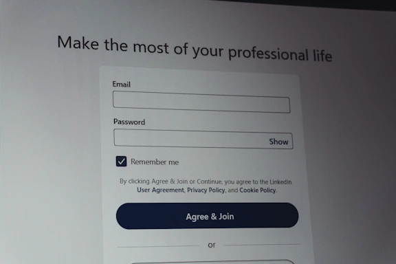 Linkedin login screen with email and password fields.
