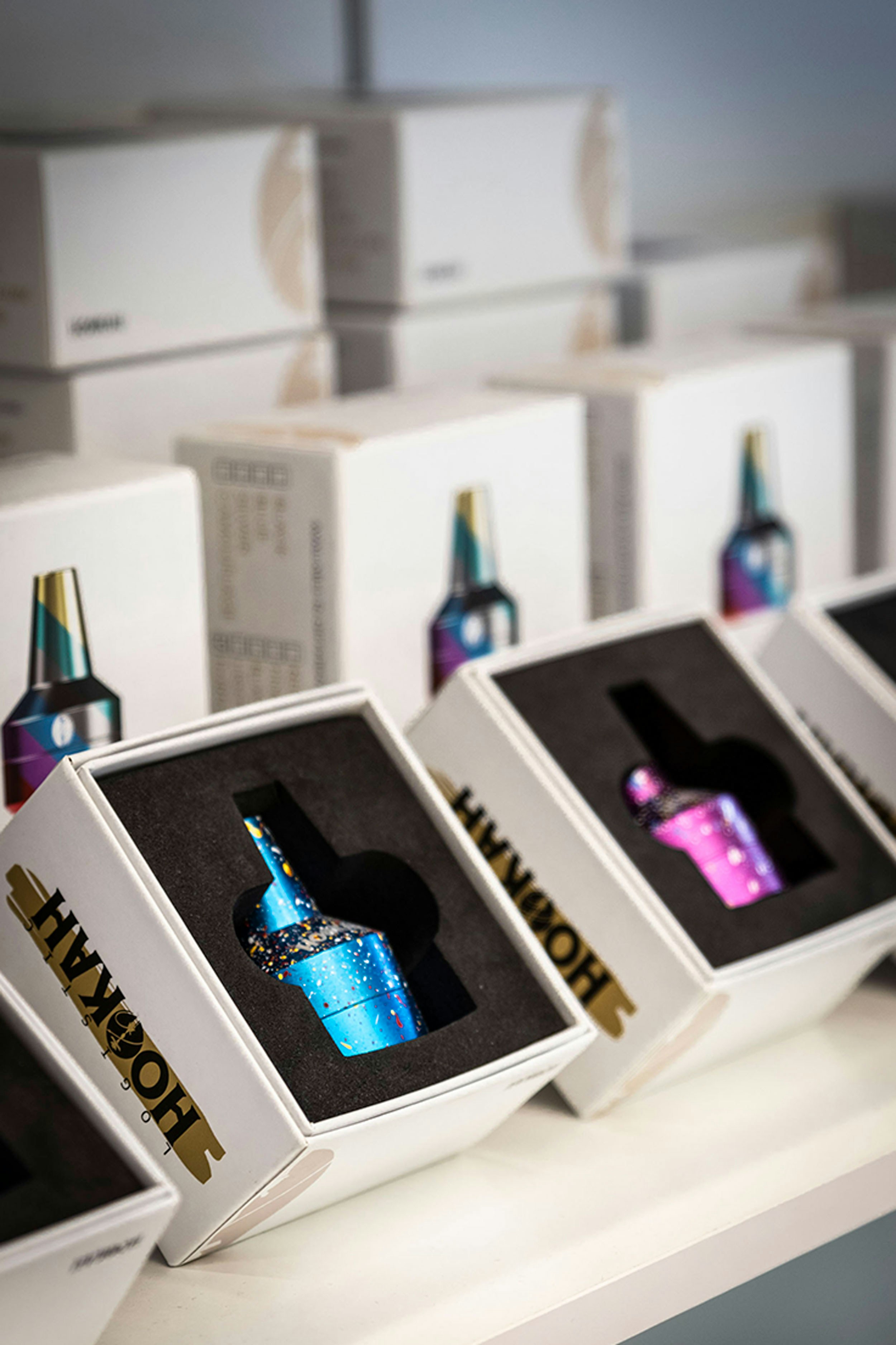 Colorful hookah pipes displayed in their boxes