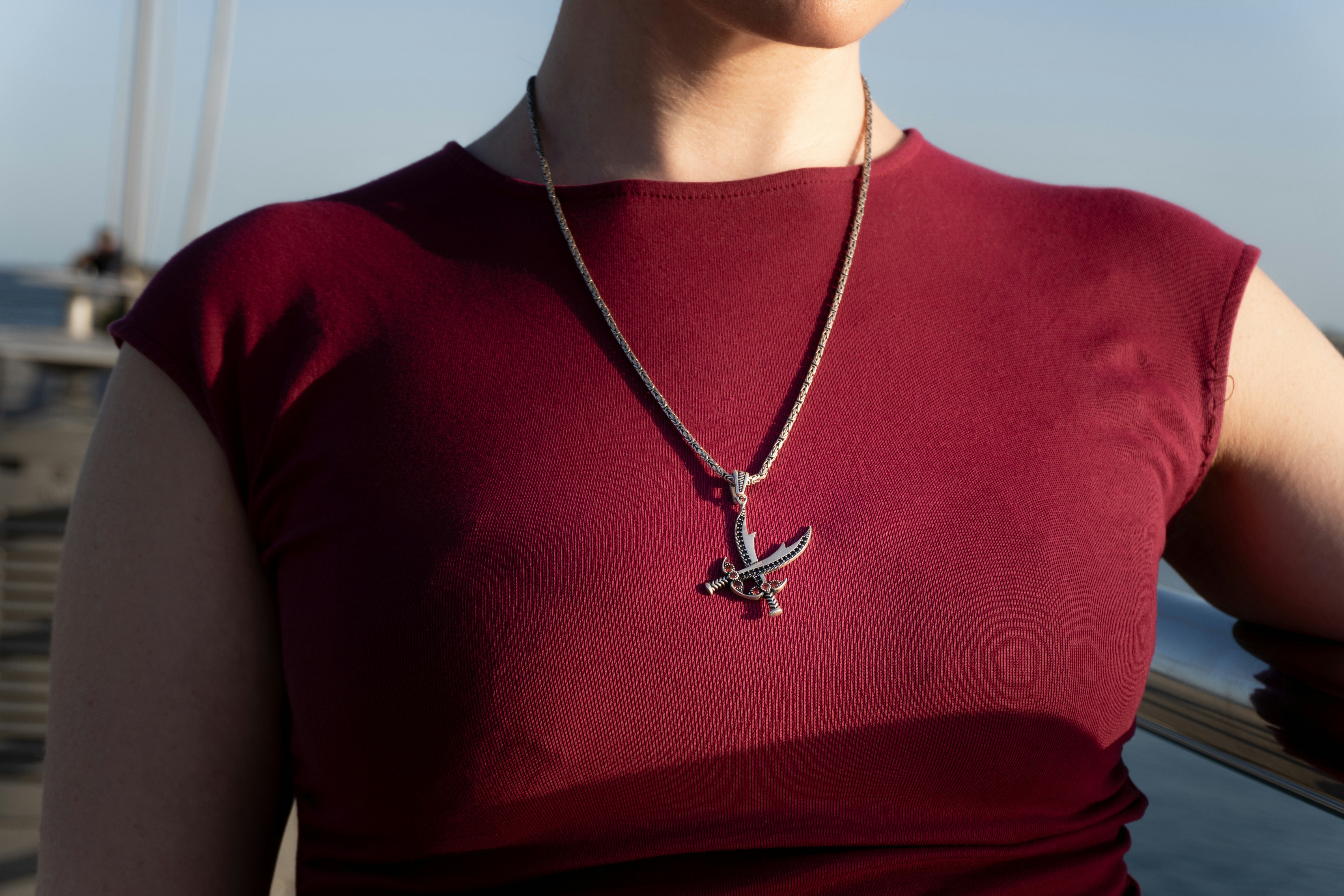 Woman wearing a silver eagle pendant necklace