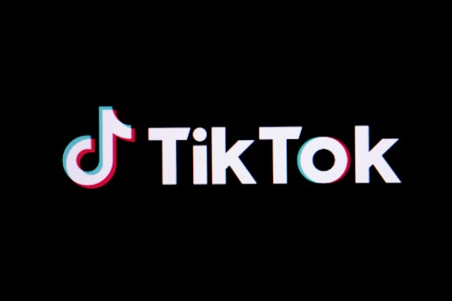 The tiktok logo on a black background