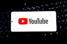 Youtube logo displayed on a smartphone screen.
