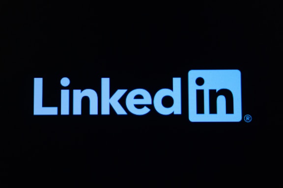 The linkedin logo on a dark background
