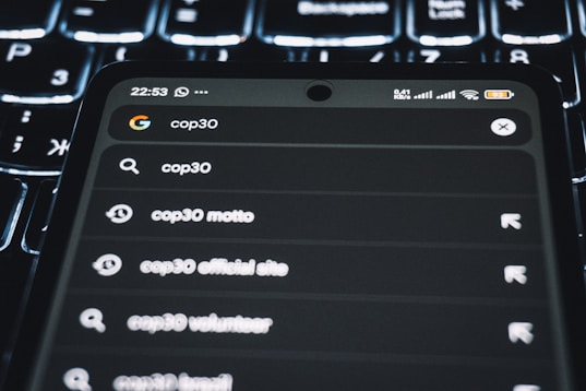Smartphone displaying search results for cop30