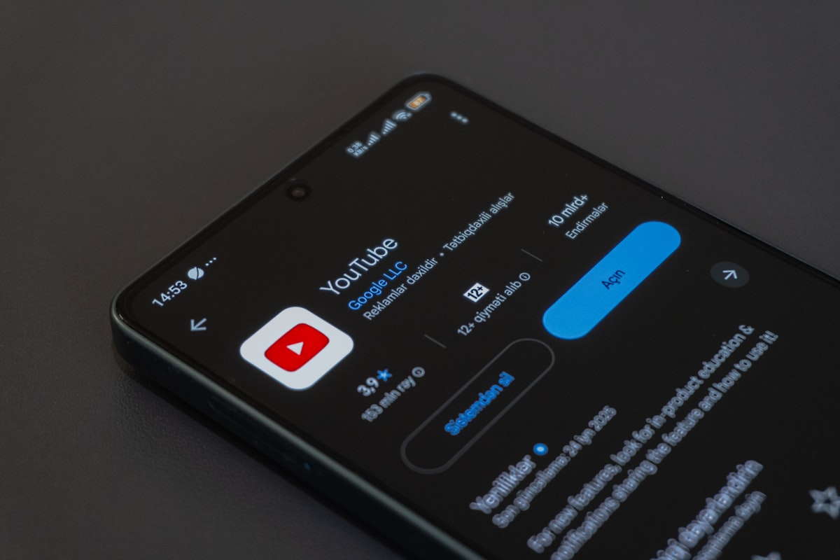 Smartphone showing YouTube app representing mobile in-stream political ad delivery in India