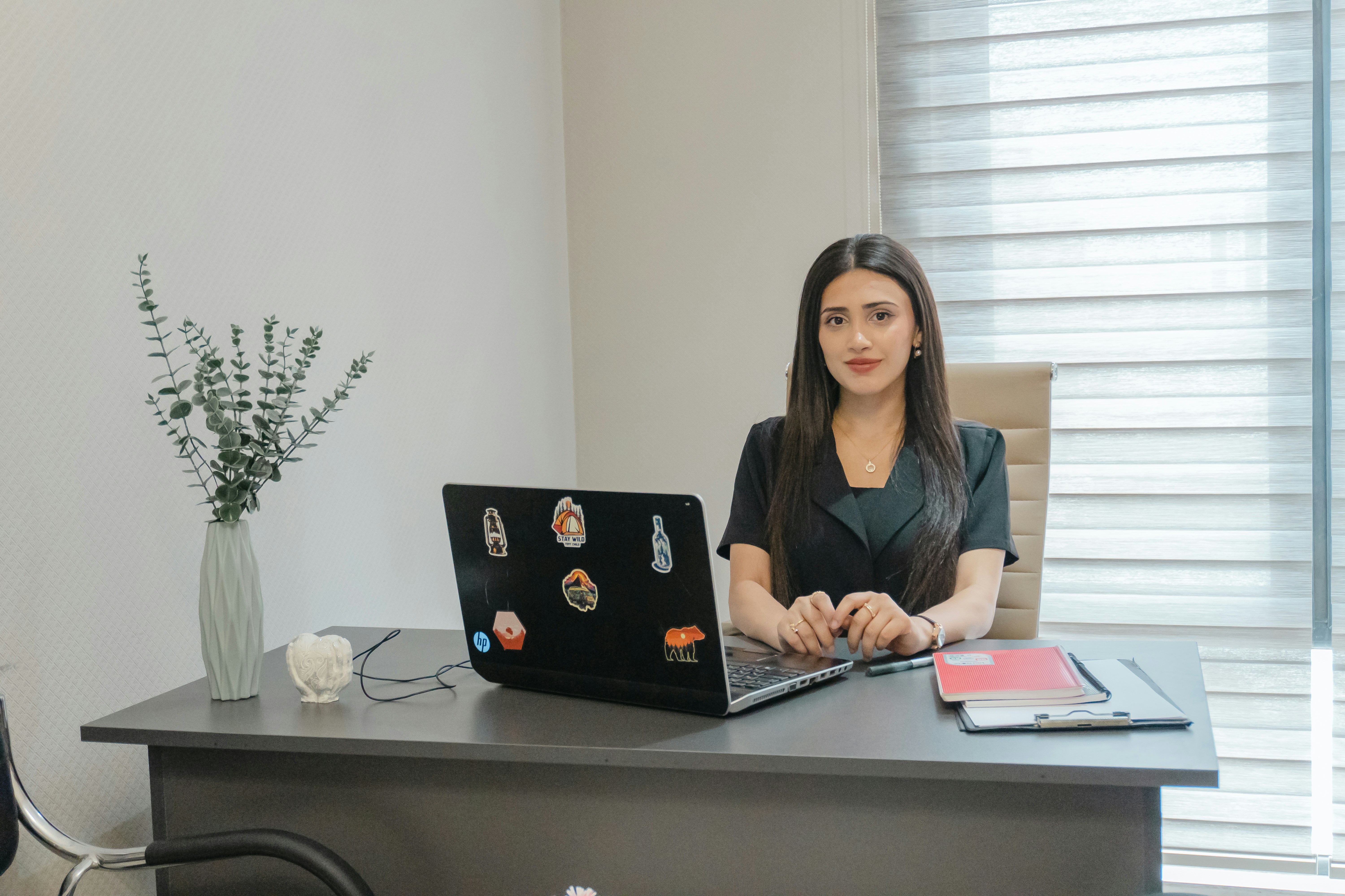 Woman at desk with laptop