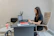Woman working on laptop at desk in office