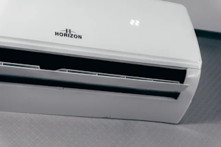 White air conditioner unit displaying 22 degrees