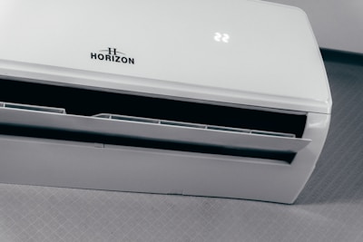 White air conditioner unit displaying 22 degrees