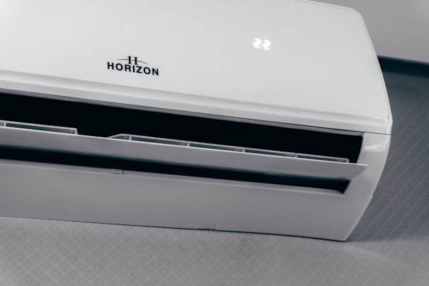 White air conditioner unit displaying 22 degrees