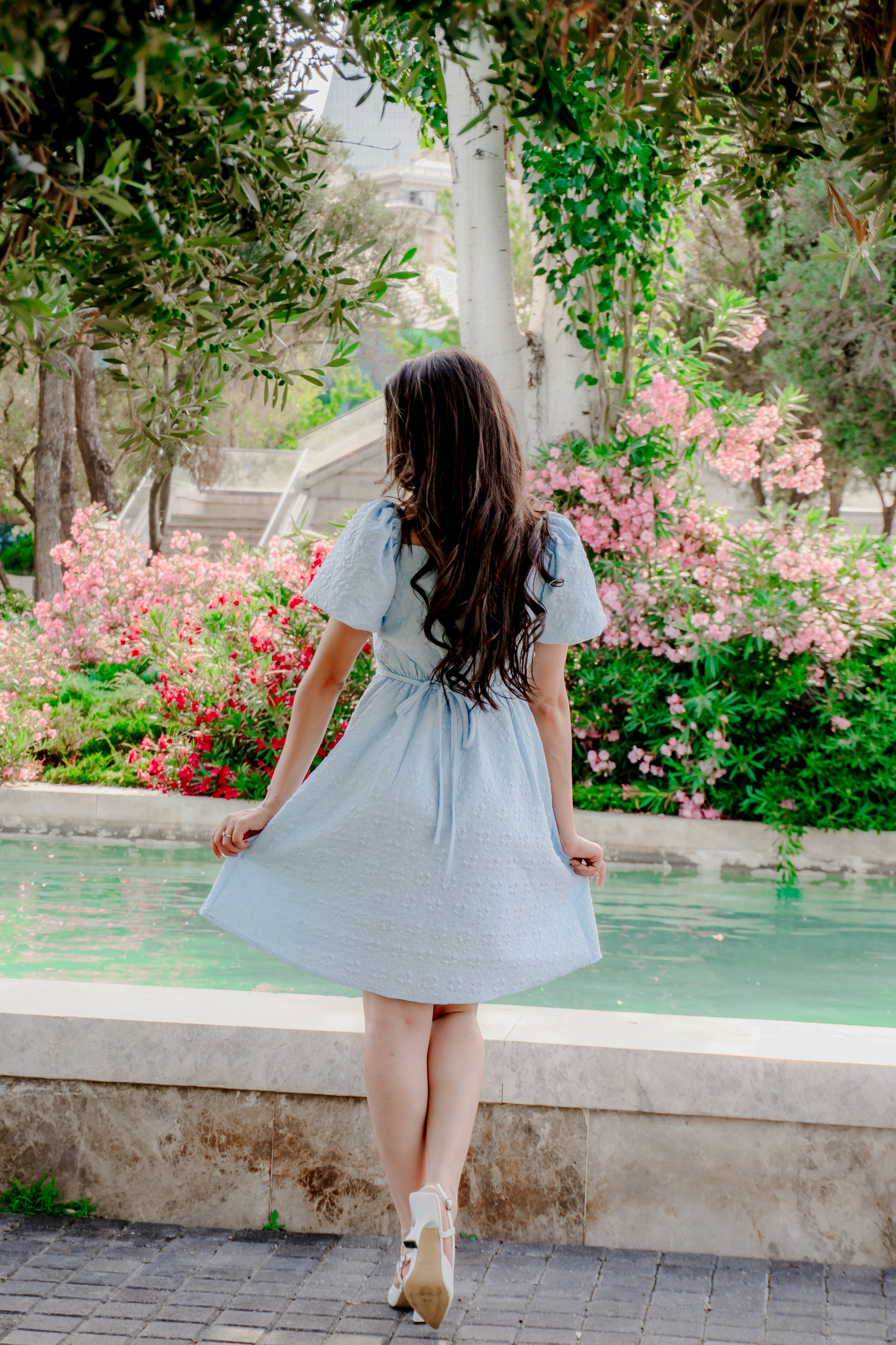 Woman in light blue dress near pink flowers photo  Free Fashion Image on  Unsplash