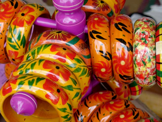 Colorful bangles with floral patterns displayed patterns displayed patterns