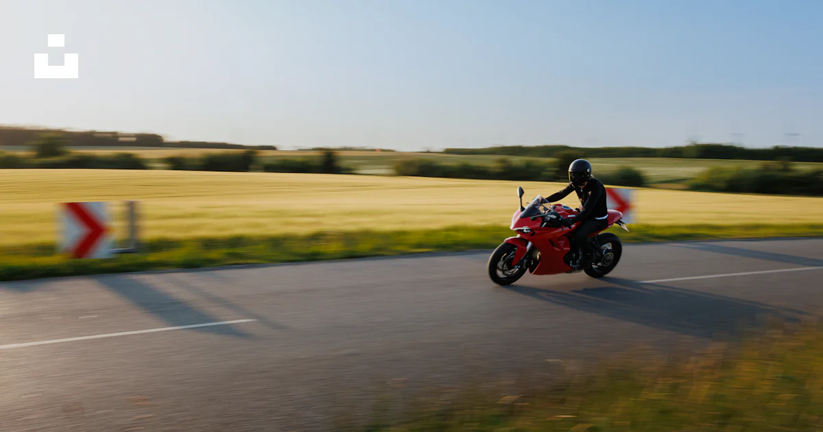 Motorcycle Ride Rv Red A person rides a red motorcycle on a sunny road. photo – Free Travel ...