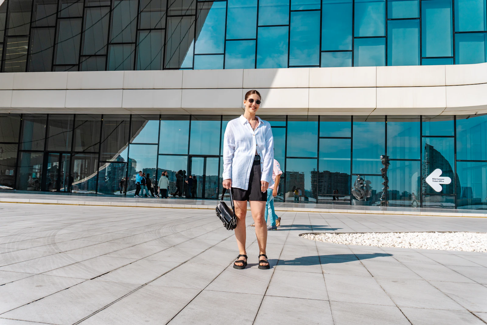 Professional standing outside a modern office building