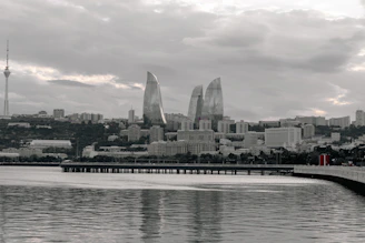 Modern cityscape with flame-shaped skyscrapers and tower buildings.