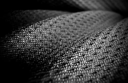 Close-up of textured fabric with a woven pattern.