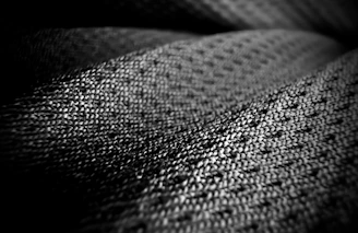 Close-up of textured fabric with a woven pattern.