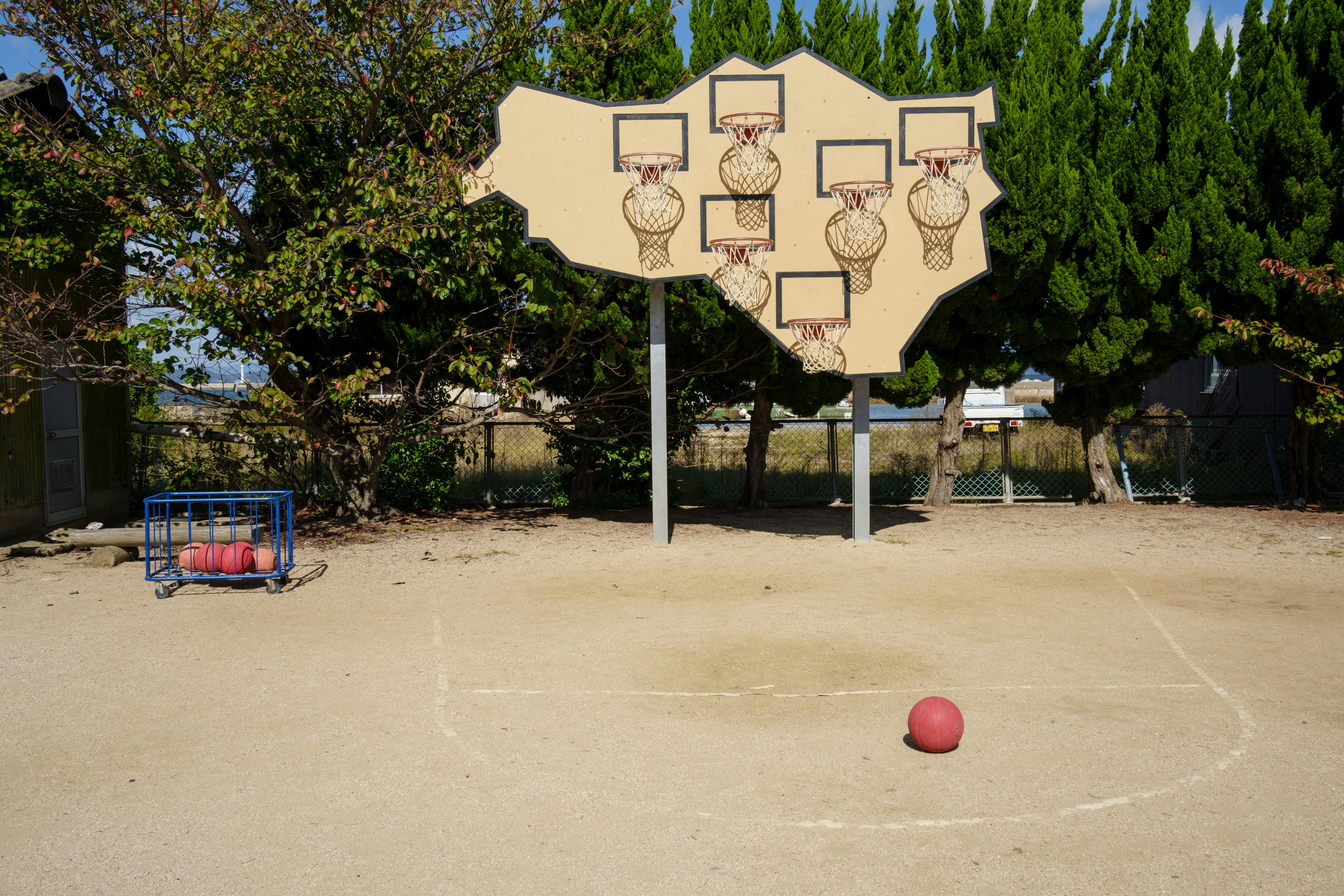 Basketball hoops on a cutout board in a court