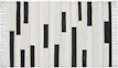 A rug with vertical stripes and black rectangles