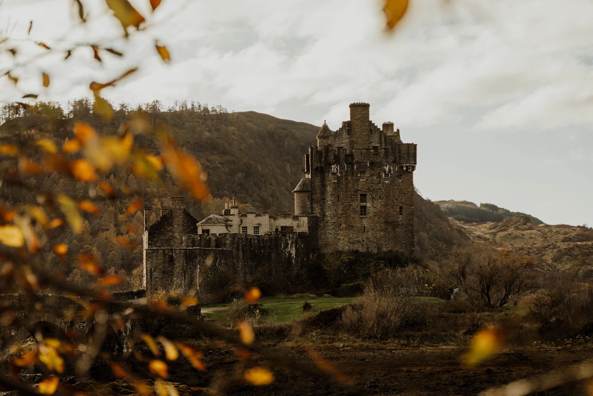 Ancient castle on a hill with autumn foliage
