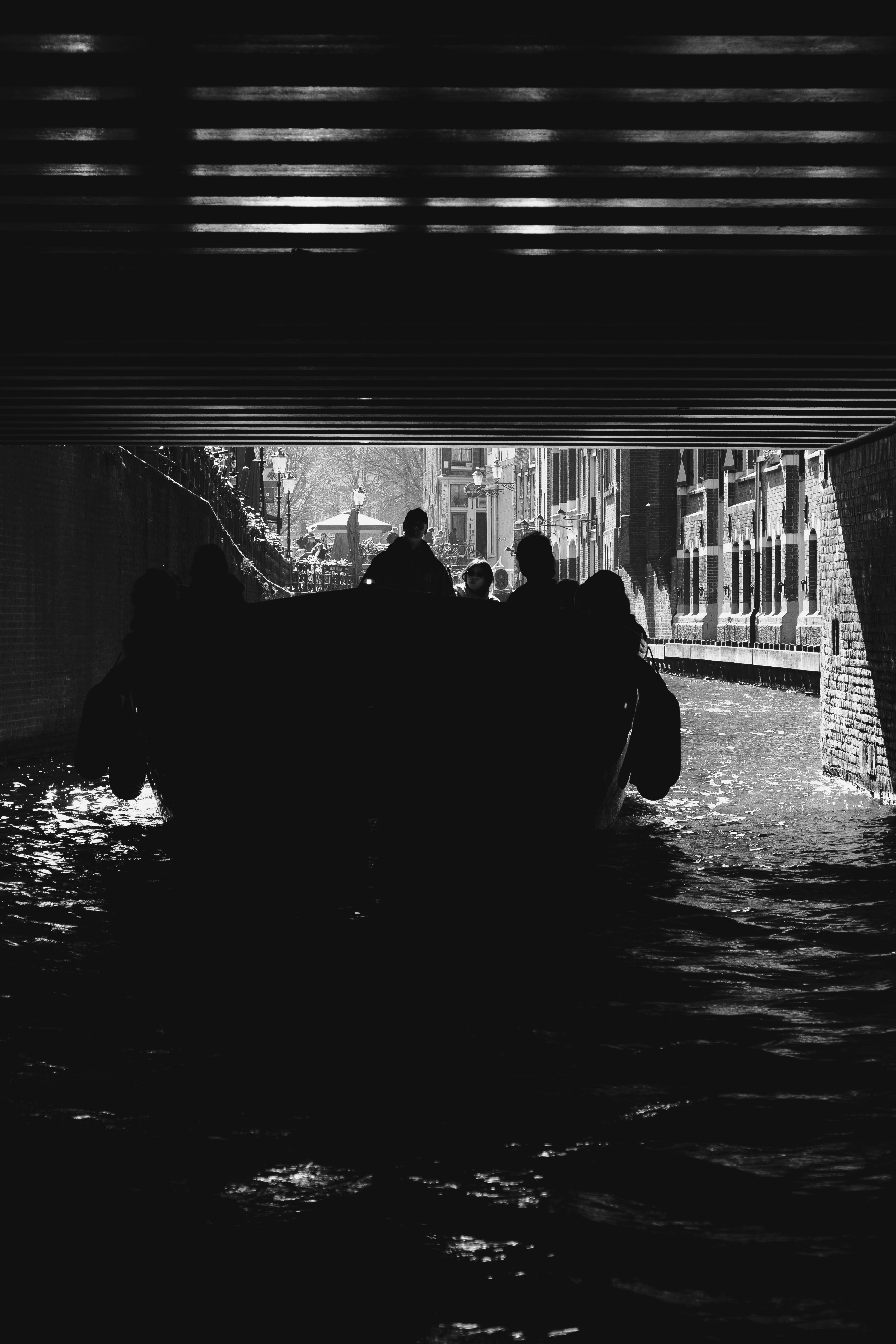 Gondola passing under a bridge in venice