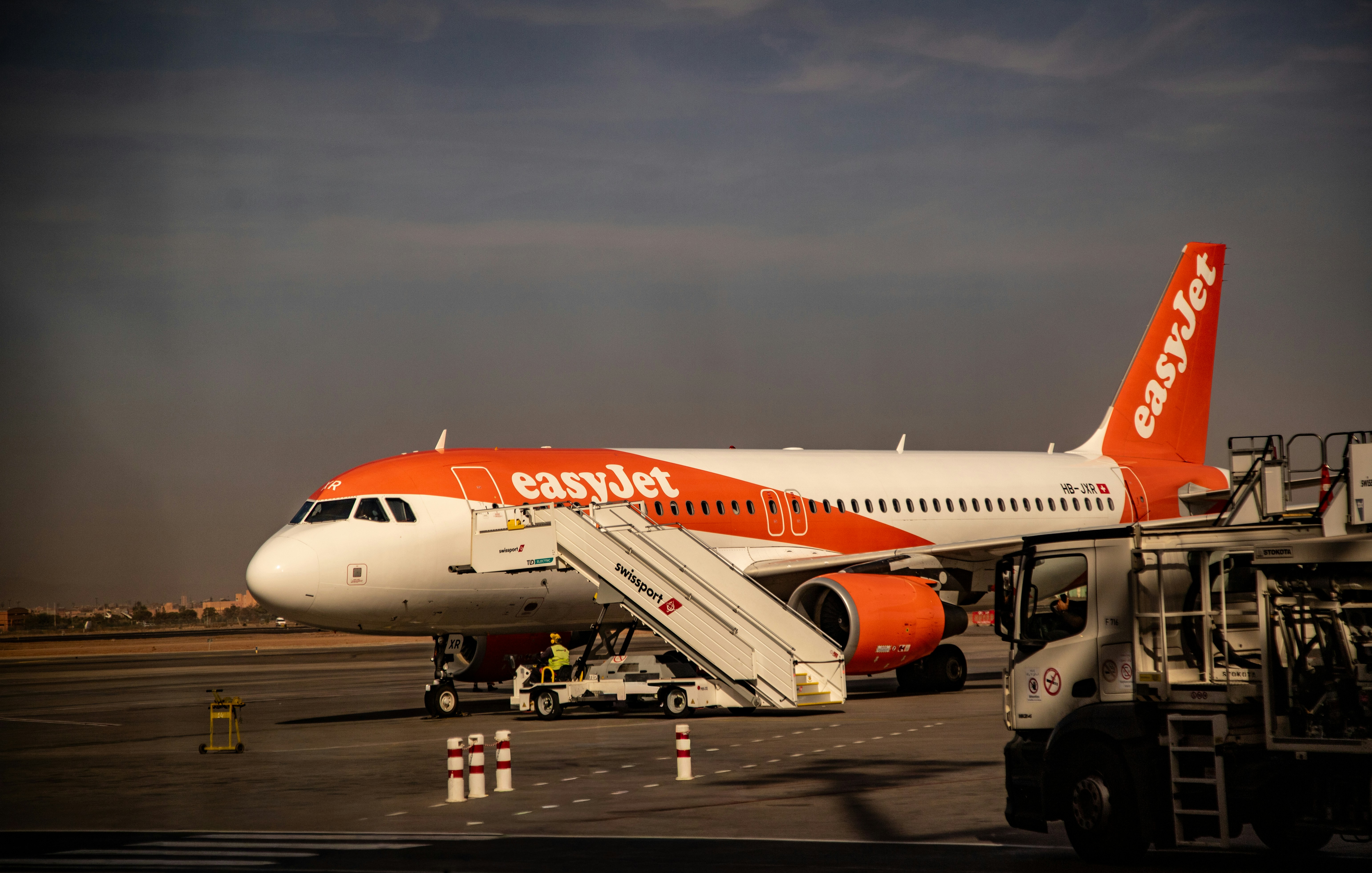 An easyjet airplane parked at the airport.