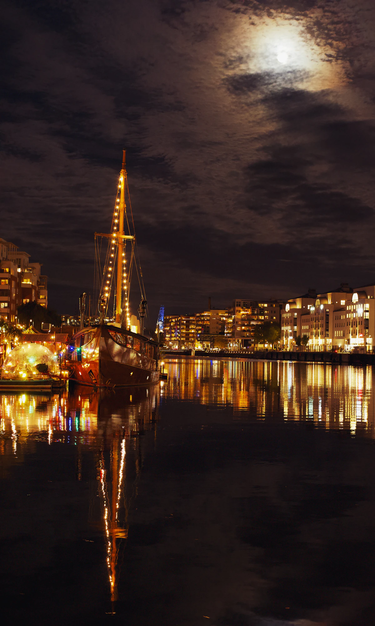 Sailboat lit at night