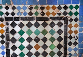 Close up of a mosaic tile pattern with diamonds.