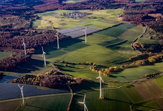 Wind turbines and solar panels in a rural landscape