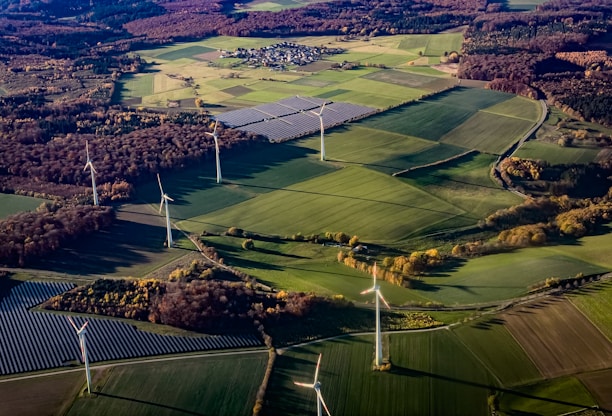 Wind turbines and solar panels in a rural landscape