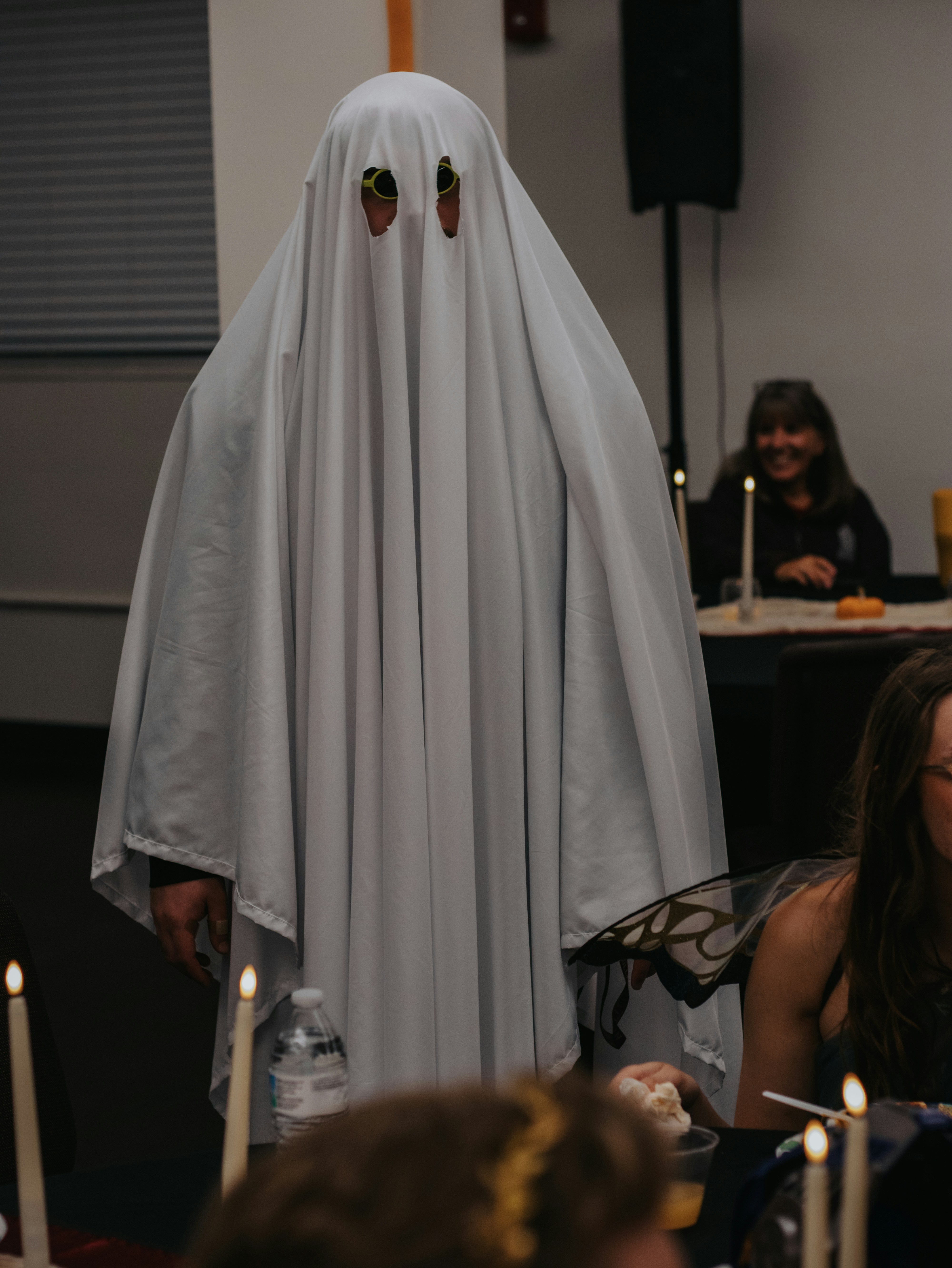 Person in a ghost costume at a party