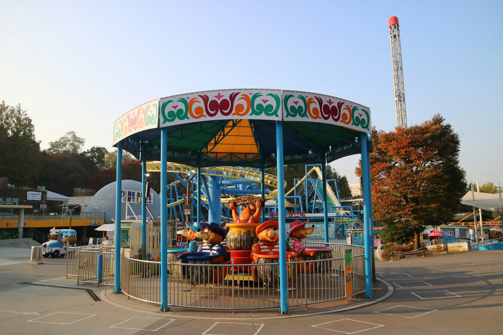 Amusement park carousel with cartoon characters