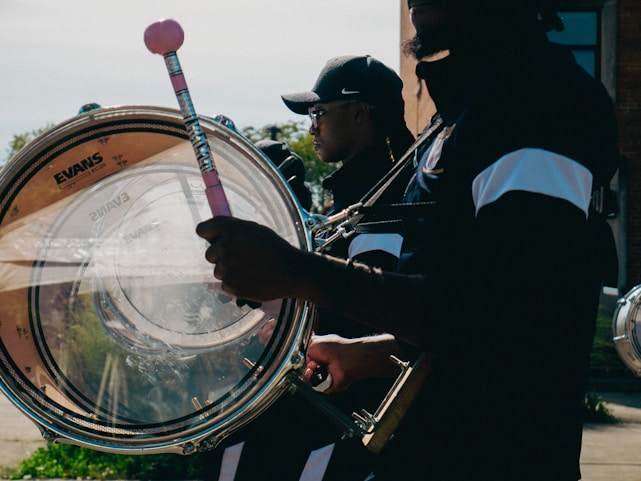 Musicians playing large drums in a parade