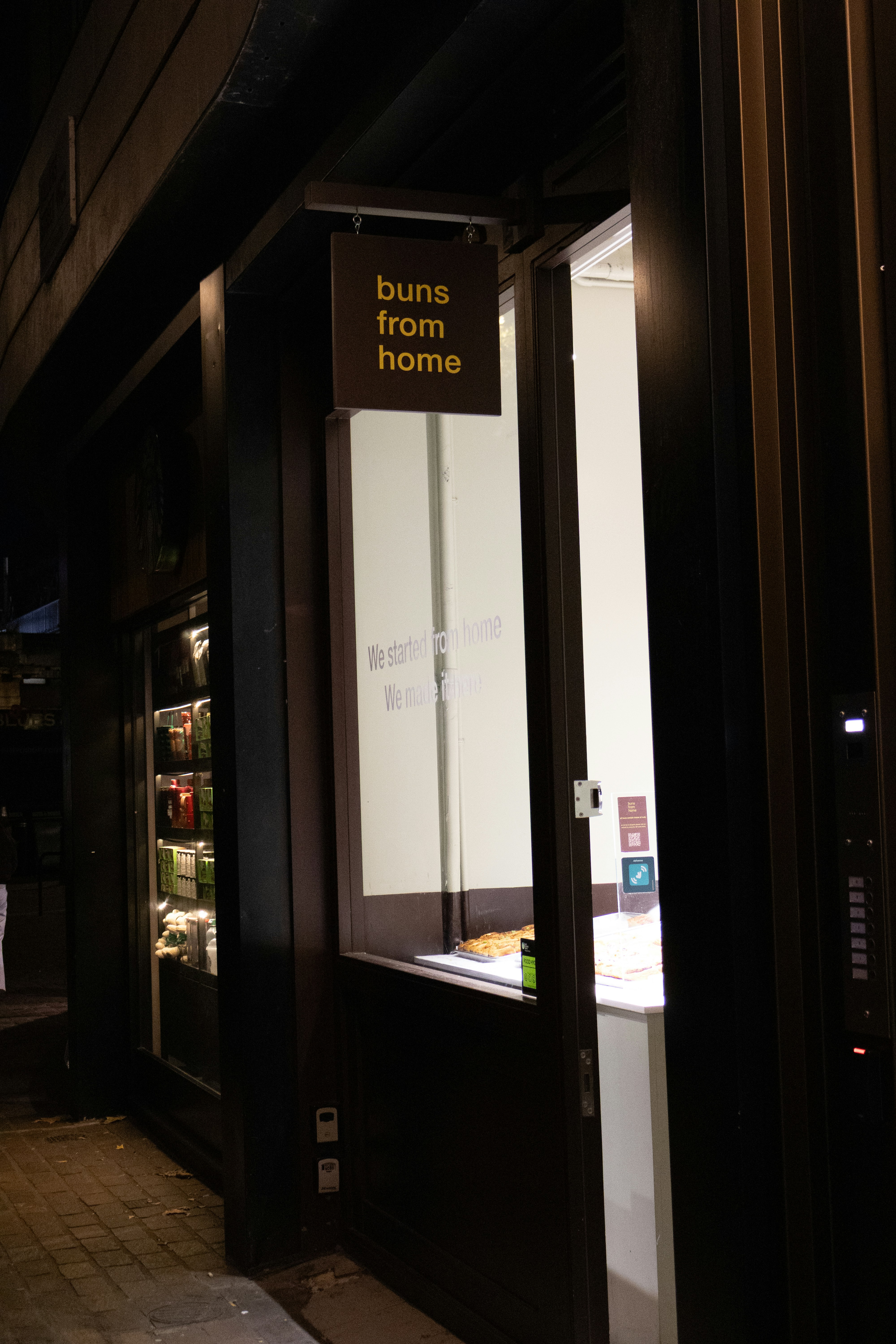 A brightly lit glass door fridge in a retail setting